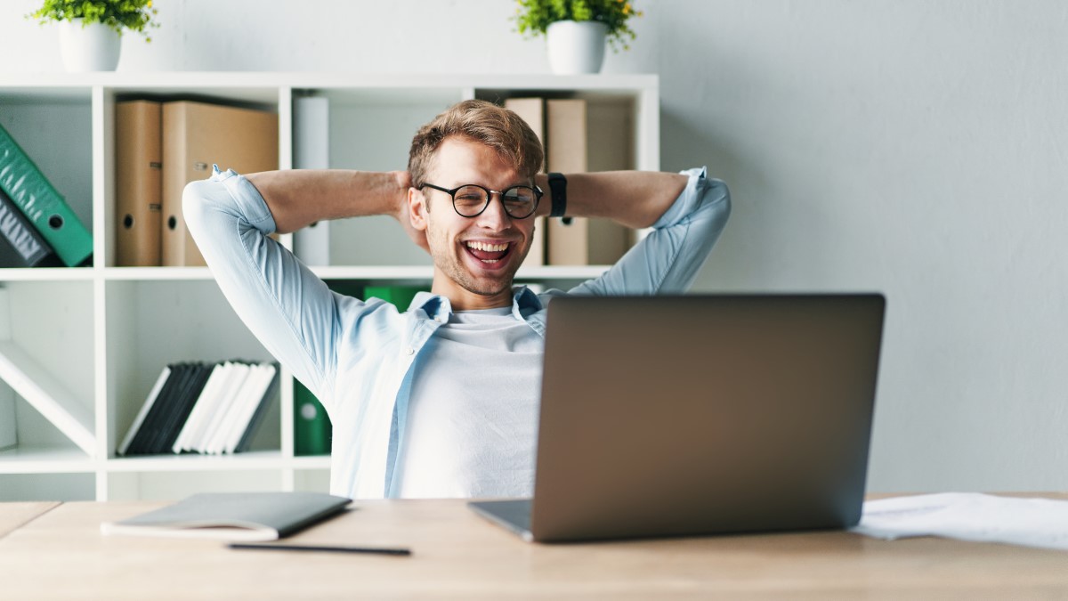 Happy member of staff working remotely